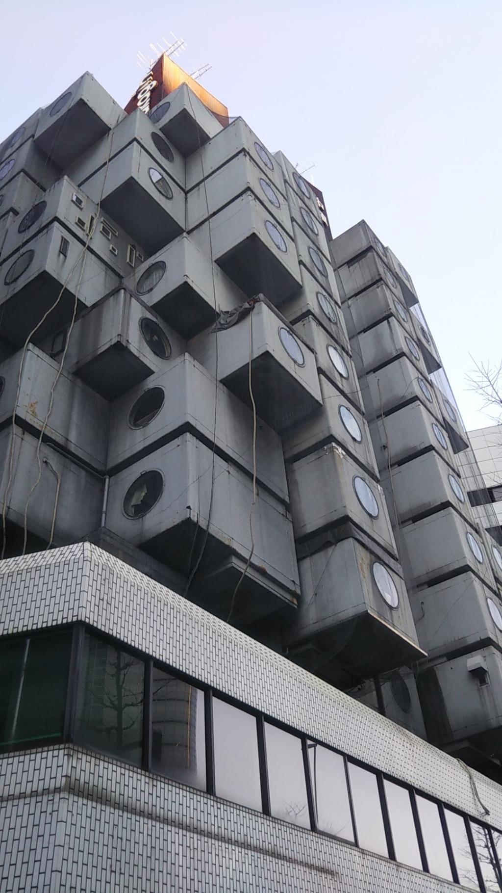 Designed by Showa's leading architect Kisho Kurokawa, Ginza's unusual shape central bank capsule tower building