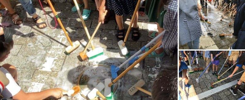 A meeting to wash the famous bridge Nihonbashi Bridge with a deck brush