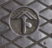  The disappearing corporate name manhole